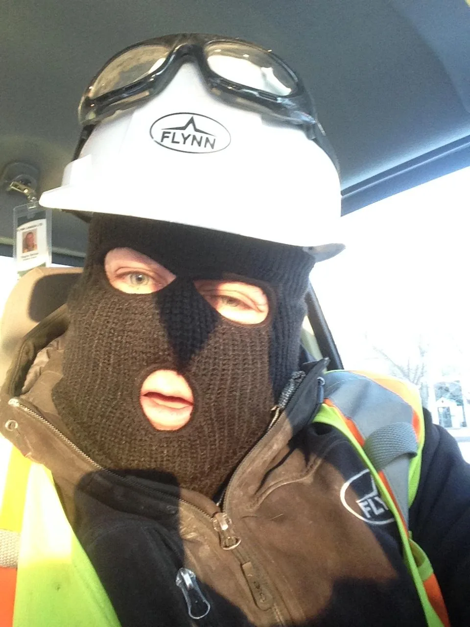 Andy Crane wearing a Flynn hard hat and balaclava, dressed for extreme cold