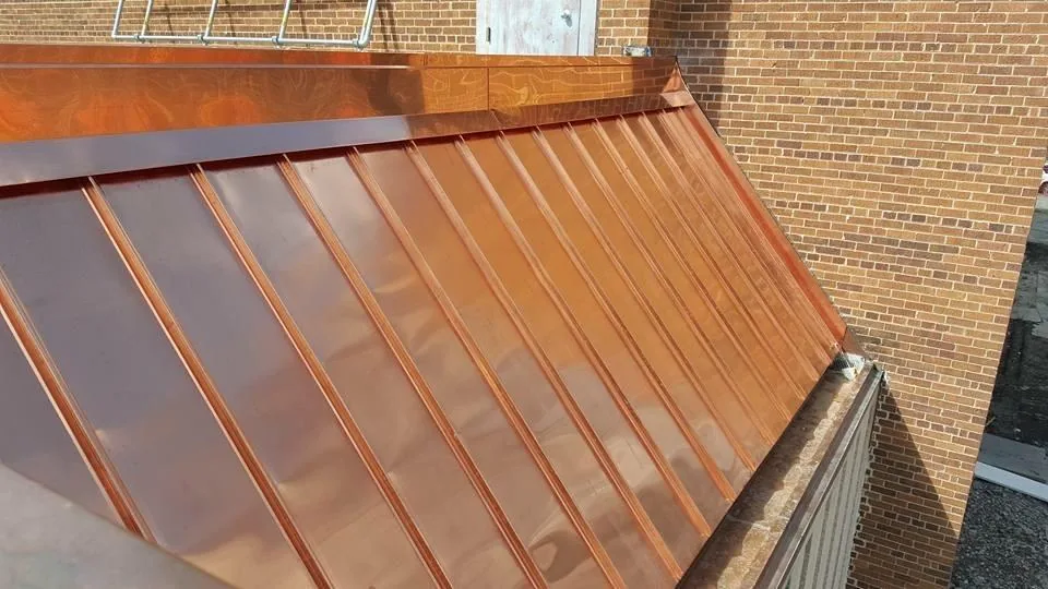 Detail of a completed copper standing-seam roof